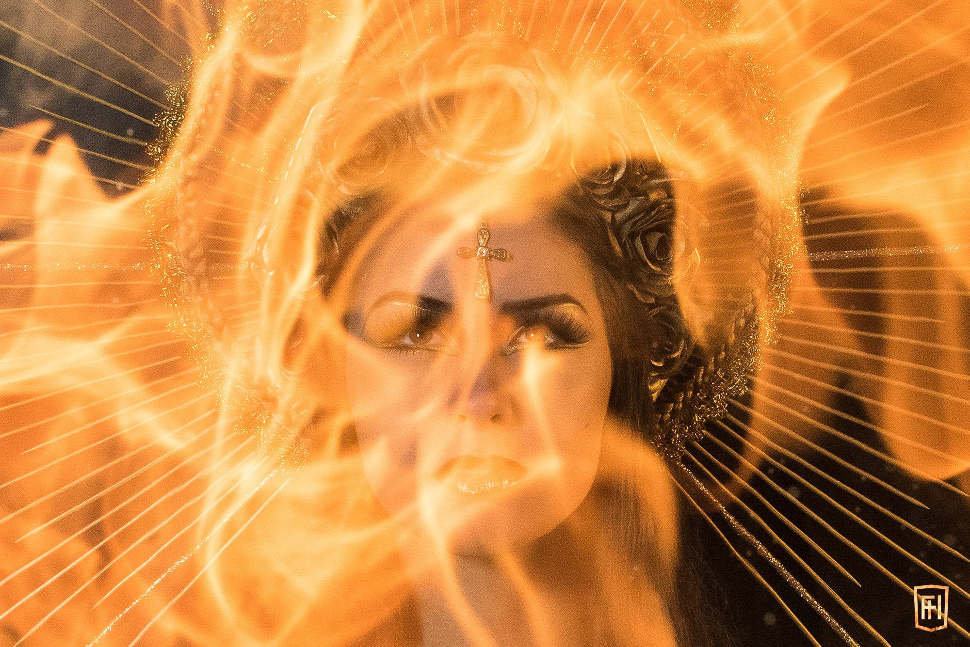 A face seen through a swirl of flame, Holy Mary, Mother of Fire