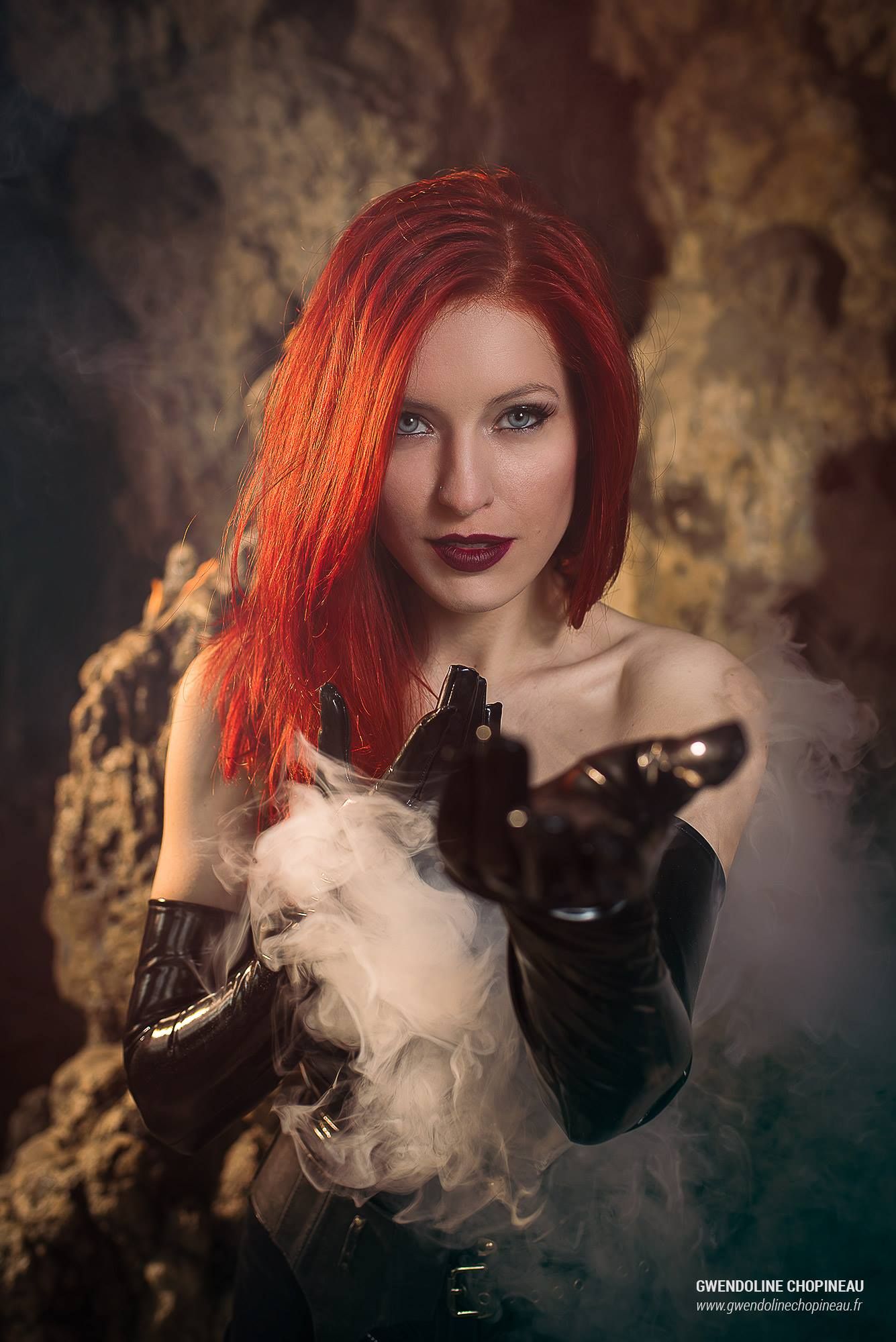 Ariel Firestone holding out a hand through smoke
